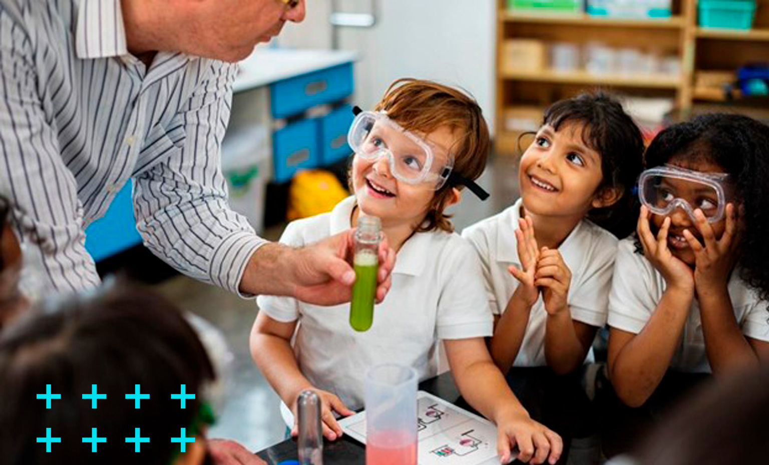 professor ensinando conceitos científicos de química básica a um grupo de quatro crianças diversas composto por dois meninos e duas meninas.